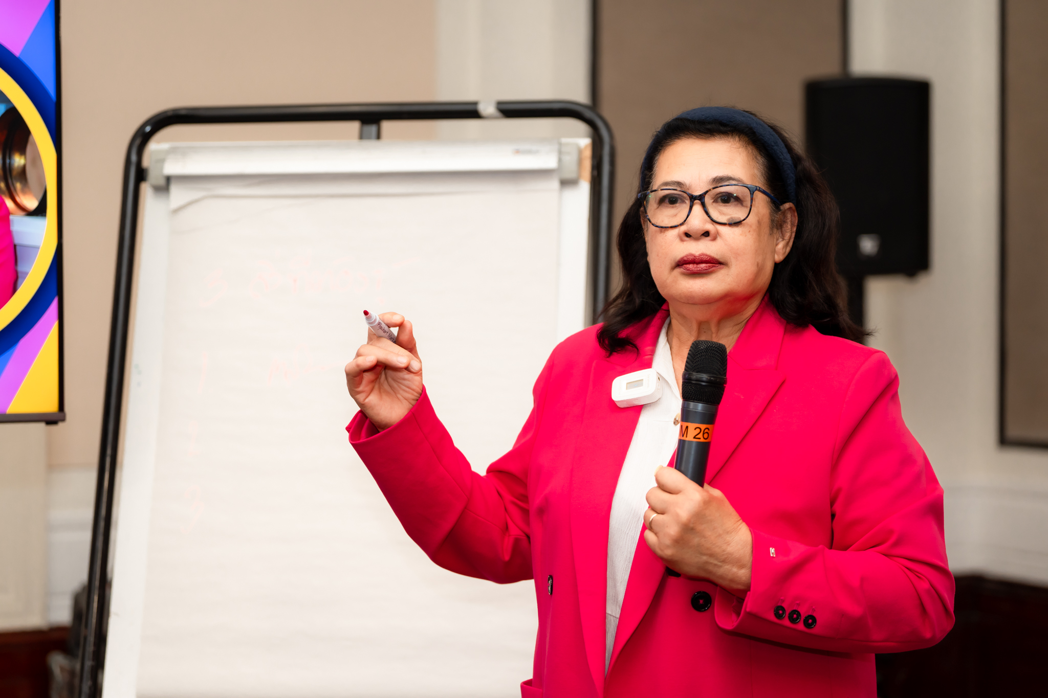 Kru Mae Orn teaching therapeutic massage with over 20 years of experience